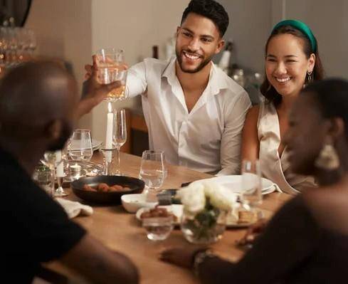 depositphotos_626386654-stock-photo-wine-toast-party-friends-table